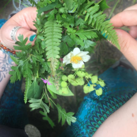 woman holds wild bouquet