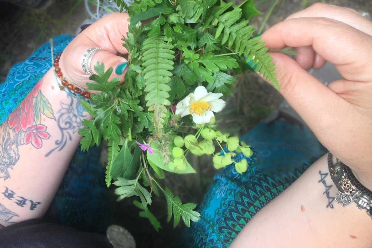 woman holds wild bouquet